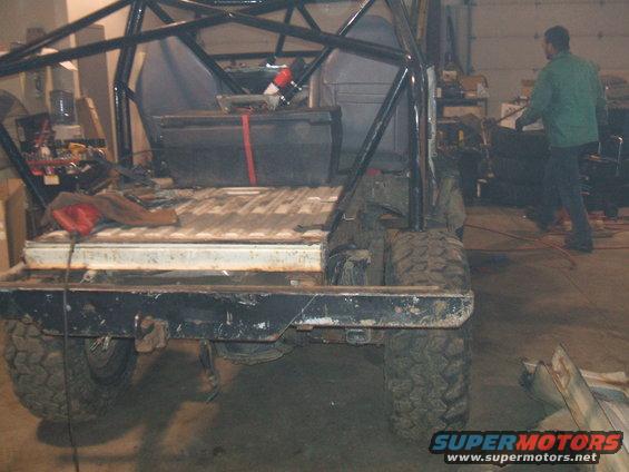 Rear view of off-road vehicle with roll cage and large tires