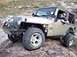 2004 Jeep TJ - This Jeep Wrangler is equipped for off-road adventures with its modified bumper and tires.
