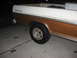 1972 Ford F-100 - This 1972 Ford F-100 pickup truck has a white and brown two-tone paint scheme and custom wheels.