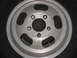 1972 Ford F-100 - A silver five-spoke wheel is shown in a close-up view, mounted on a black tire.