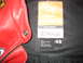 2005 Yamaha R1 - A close-up view of a red leather motorcycle jacket's interior tag and material.