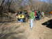 1996 Ford Bronco - Off-roading group works on a Jeep Wrangler stuck in the dirt.