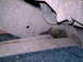 1987 Ford Bronco II - Fluid leak visible on the underside of a vehicle's frame structure.
