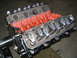 1979 Ford F-150 - This image shows a V8 engine block with visible valve train components and an orange intake manifold.