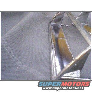 Chrome grille section with SuperMotors logo at bottom