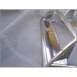 1972 Ford Ranchero - Close-up of a chrome grille piece, likely a car part, with a SuperMotors logo.