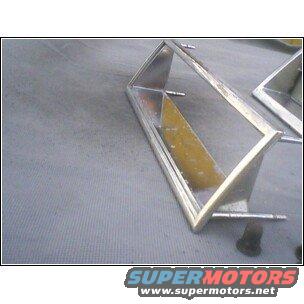 Two chrome trim pieces with yellow backing, possibly for a car's headlight or grille