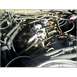 1972 Ford Ranchero - Close-up view of an engine bay, focusing on the carburetor and surrounding components.