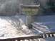1978 Ford Bronco - A bridge is partially collapsed over a fast-moving, muddy river, with railroad tracks visible below.
