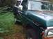 1979 Ford Bronco - This green SUV is parked outdoors, showing some wear and tear on the front.