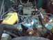 1979 Ford Bronco - Close-up of a Ford V8 engine bay, showing the ignition system and carburetor.
