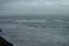 1993 Ford Bronco - The ocean churns with waves under an overcast sky, viewed from a cliffside.