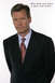 1992 Ford Mustang - A man in a suit and tie is pictured with text overlaying the image.