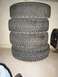 1985 Subaru Brat - A stack of four tires sits on the floor, possibly for sale or storage.
