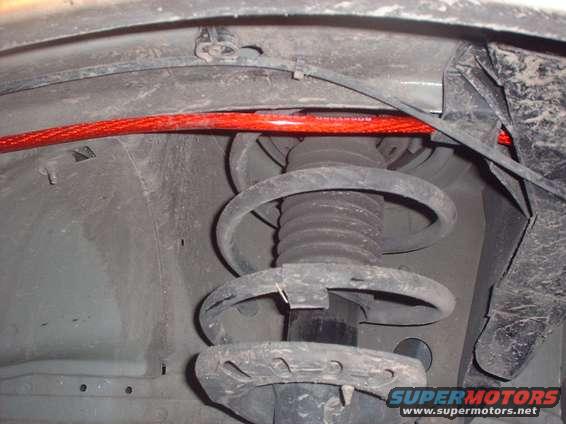 Red sway bar above suspension strut