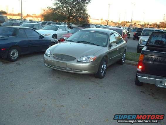 Gold 2000 Ford Taurus sedan, 3/4 front view