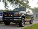 1995 Ford Bronco - This black 1995 Ford Bronco is equipped with a brush guard and aftermarket wheels.