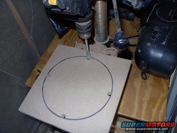 Drill out four holes to ease access for your jigsaw. The MDF is 10 1/4" square and starts out as 3/4" thick.