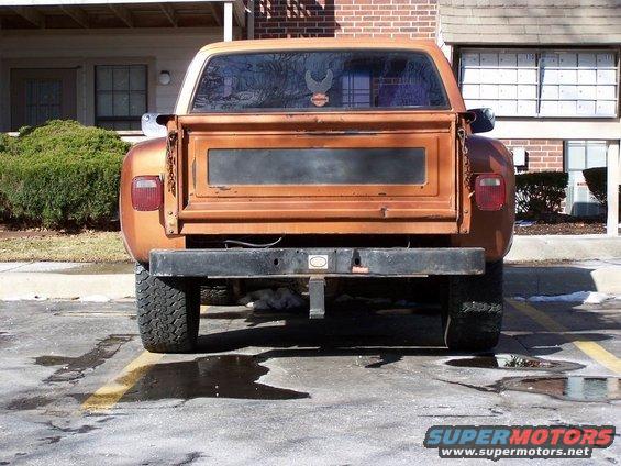 Rear view of an orange 1979 Chevrolet C/K Pickup truck