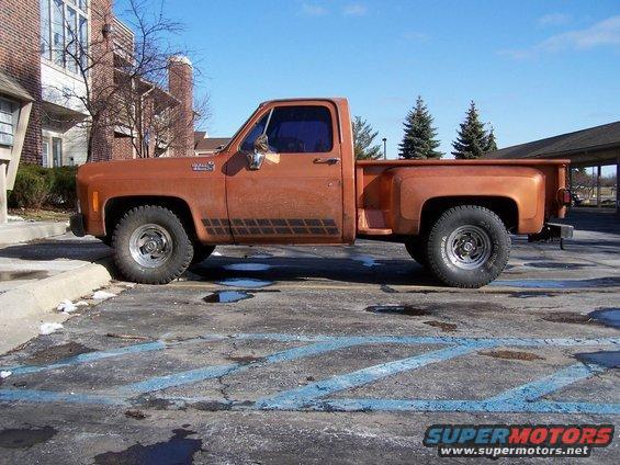 1979 Chevrolet C/K Pickup parked on asphalt with blue painted lines