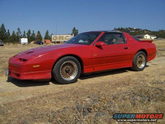 Red 1989 Pontiac Trans Am parked outdoors