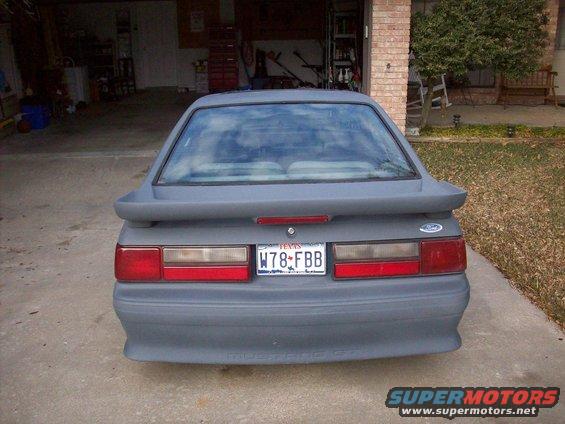 1989 Ford Mustang GT rear view, primer gray paint, Texas license plate W78-FBB