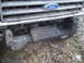 1989 Ford Bronco - Custom winch mount fabricated and bolted to the front of a Ford truck, with 'Back' and an arrow marked on the metal.