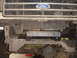 1989 Ford Bronco - Front view of a Ford truck showing the grille, radiator, and a custom fabricated part mounted to the frame.