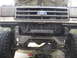1989 Ford Bronco - Front view of a 1989 Ford Bronco, modified with a winch mount and off-road tires.