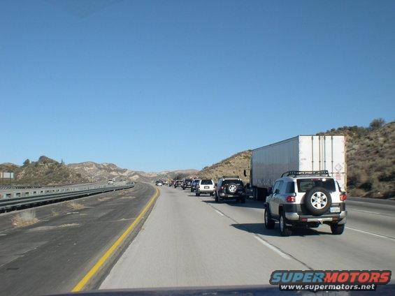 Silver 2007 Toyota FJ Cruiser from rear on highway