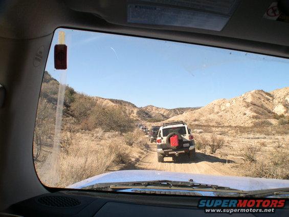 White 2007 Toyota FJ Cruiser with red gas can on rear