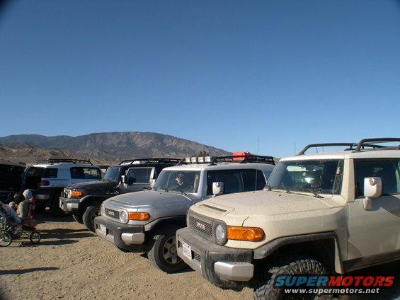Tan 2007 Toyota FJ Cruiser in a line of similar vehicles