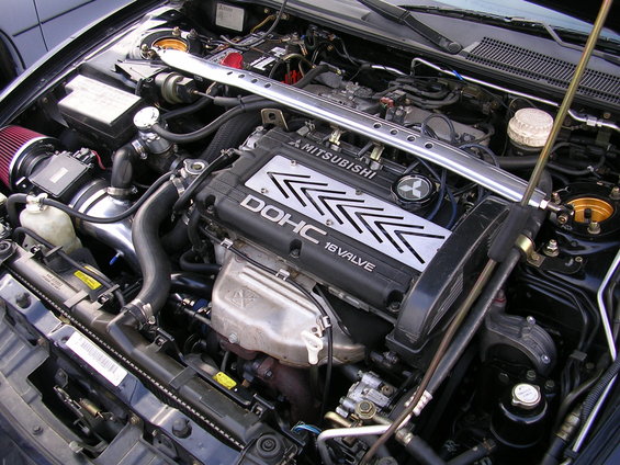 Mitsubishi 4G63 DOHC 16-valve engine with aftermarket intake and strut bar