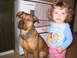 2001 Ford Crown Victoria - A dog and a child pose for a photo in what appears to be a kitchen.