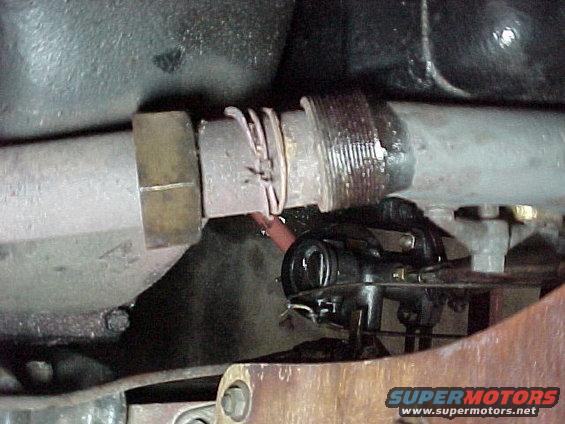 Exhaust manifold is early type with packing instead of flare connection