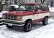 1989 Ford Bronco II - A two-tone red and white Ford Bronco II sits in a snowy environment.