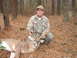 1995 Ford Bronco - Hunter poses with a harvested buck in a wooded area.