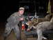 1995 Ford Bronco - A hunter poses with two deer loaded into the bed of a utility vehicle after a hunt.