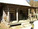 1995 Ford Bronco - A rustic log cabin porch features two rocking chairs and a person in camouflage.