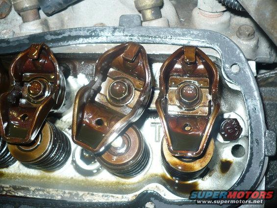 Engine valve train with rocker arms and valve springs visible