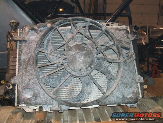 Radiator and fan assembly with visible Supermotors.net logo