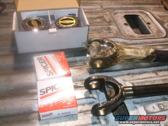 Two Spicer U-joint boxes and two driveshaft yokes with Spicer part number 5-806X visible