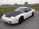 1991 Nissan 240SX - This 1991 Nissan 240SX is seen from the front-three-quarter view, a contrasting black hood.