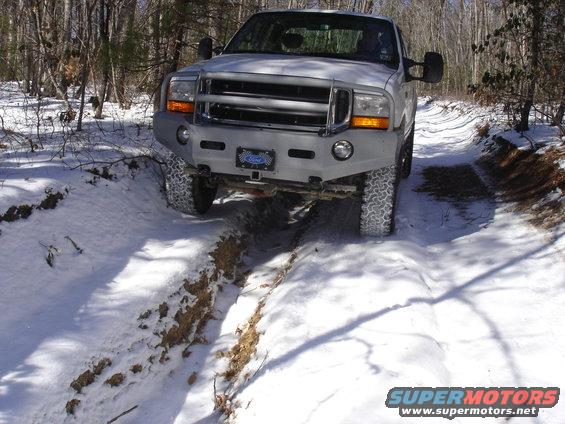 White 2001 Ford F-250 front view on snowy trail