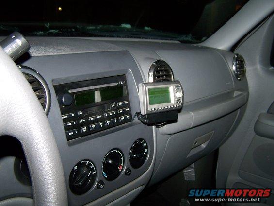 Dashboard of a 2004 Ford Expedition with a mounted GPS unit above the radio