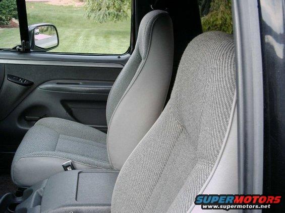 Interior view of a truck cab showing front seats and door panel
