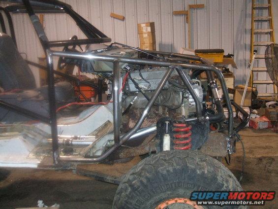 off-road vehicle build with roll cage and engine exposed