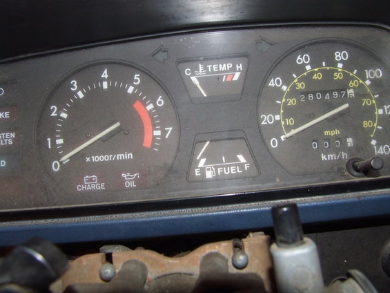 Tachometer, speedometer, fuel, and temp gauges in a car