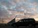 2002 Volkswagen Passat - Station wagon parked in front of a modern building during a cloudy sunset.