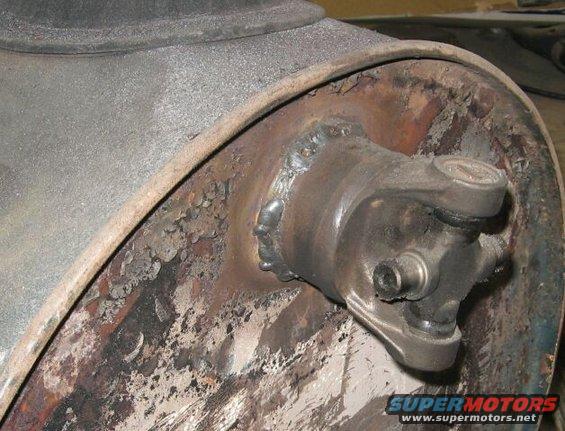 Driveshaft U-joint with visible welds and rust